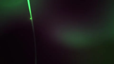 Green laser beam in dark space with light effects. Stock Footage 335527307