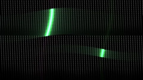 Green laser lights on dark background with grid pattern. Stock Footage 336244250
