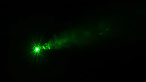 The green laser ray shining in darkness. slow motion Stock Footage 163321714