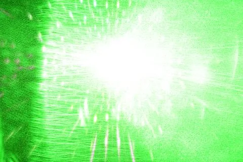 Green laser shining into camera  Stock Photos