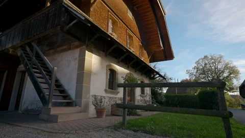 Green lawn in yard of large two-storey rural cottage house Stock Footage 228917807