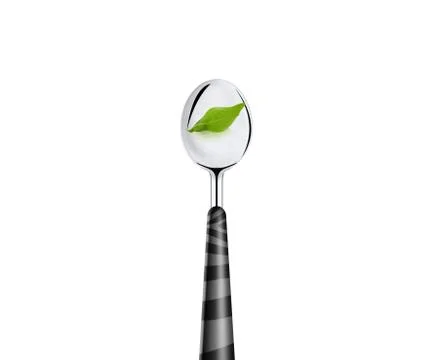 Green leaf and spoon Stock Photos