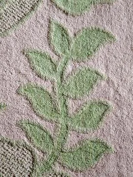 Green leaf pattern on fluffy towel fabric texture Stock Photos