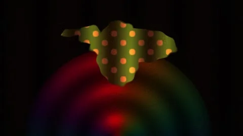 Green leafy vegetable with orange spots on a dark background with red light. Stock Footage 337476303