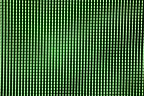 Green LED screen overlay, pixel matrix structure macro view on computer mon.. Illustrazione stock