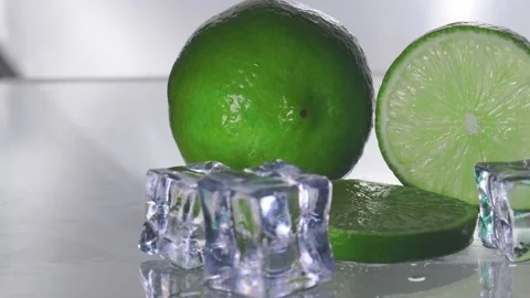 The green lemon is blank with a cut piece showing the inside of the citrus ze Stock-Footage 201085148