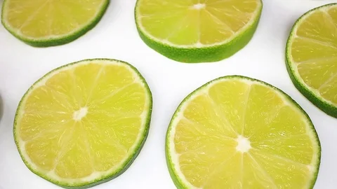Green lemon lime fruit slices looping texture pattern closeup video Stock-Footage 99012671