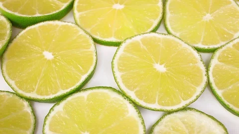 Green lemon lime fruit slices looping texture pattern closeup video Stock-Footage 99017367