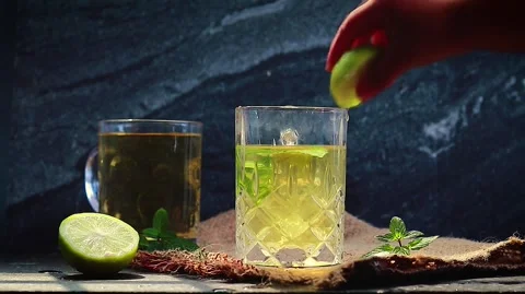 Green Lemon Tea: Fresh Brew in Ceramic Cup Stock Footage 343657559