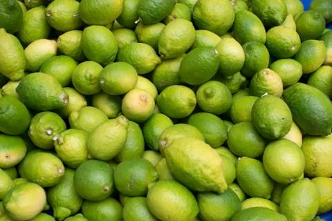 Green lemons backgrounds Stock Photos