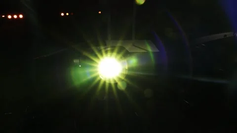 Green lens flare projector light shining in darkness Видео 346990280