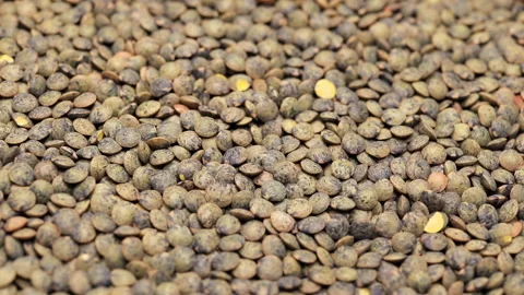 Green lentils slowly rotating, macro closeup Stock Footage 132644551