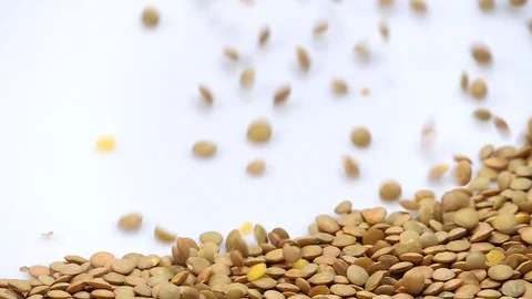 Green lentils on white background falling from top and filling up frame. slow Stock Footage 108116654