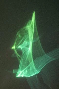 Green light abstract ribbons create ethereal neon waves for modern design and Stock Photos