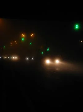 Green light and headlights Stock-Fotos