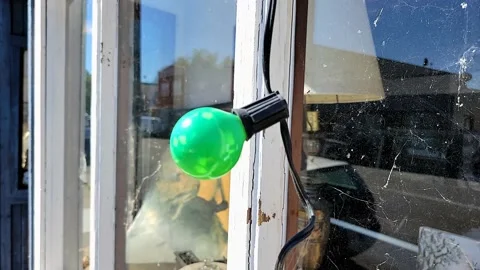 A green light bulb welcome to the town of Isleton, California Video stock 150320138