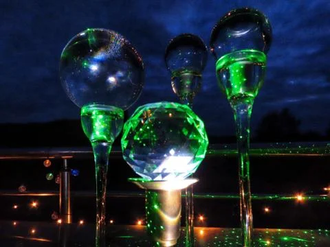 Green light in different balls Stock Photos