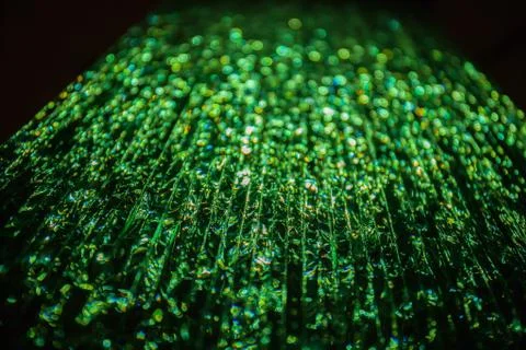 Green light passing through a stack of glass. Abstract background, bokeh 스톡 사진