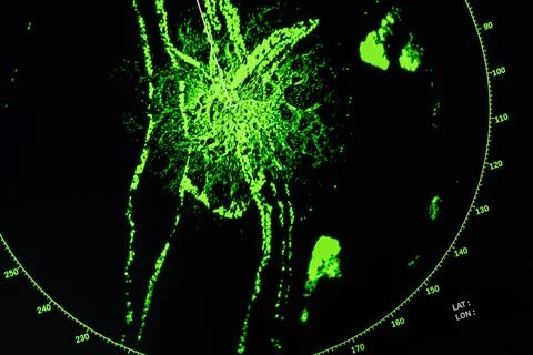 Green light patterns on a radar screen display on a dark background, 写真素材