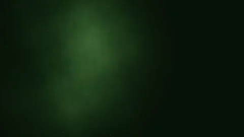 Green light plume ascends and disperses in dark space Video stock 330059575