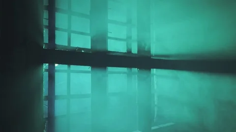 Green light rays behind the window (closeup version 1) Stock Footage 105303689