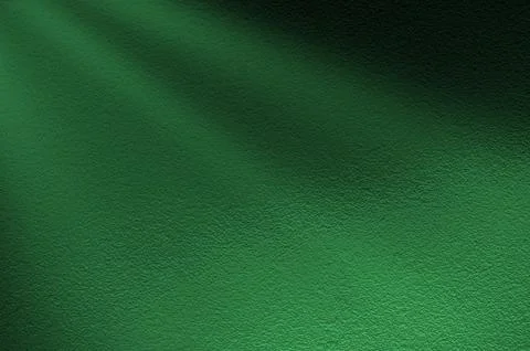 Green light rays on dark green background. Abstract green light background. Stock Photos