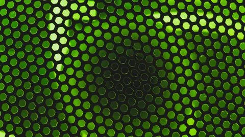 Green light shines through the ventilation grid holes of computer air cooling Stock Photos