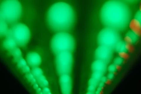 A green lighted display with many small green lights Stock Photos