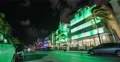 Green lighted Ocean Plaza at night, time-lapse Miami 4k or 4k+ Resolution