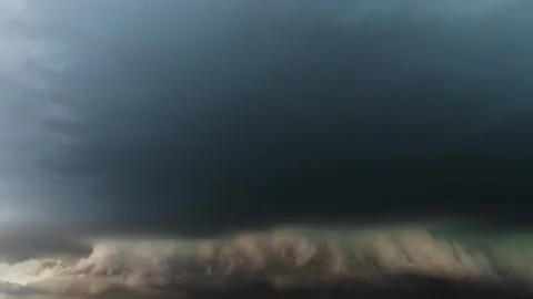 Green lightning flashing inside a severe thunderstorm cloud Stock Footage 333150619
