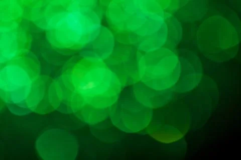 Green lights abstract bokeh backdrop. Chrismas lights bokeh. Stock Photos
