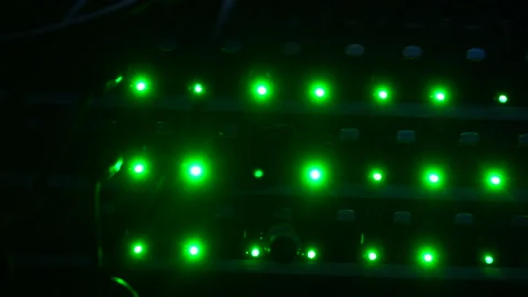 Green lights of blinking on back side of working data server or back of the Video stock 161093935