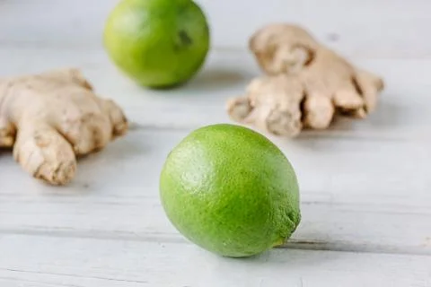 Green lime and ginger root Stock Photos