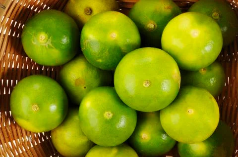 Green lime in basket Stock Photos