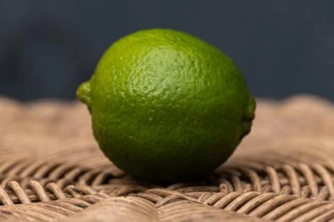 Green Lime with a Blue Background Stock Photos