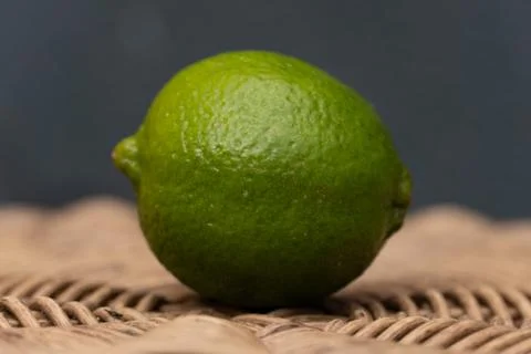 Green Lime with a Blue Background Stock Photos