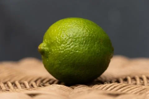 Green Lime with a Blue Background Stock Photos