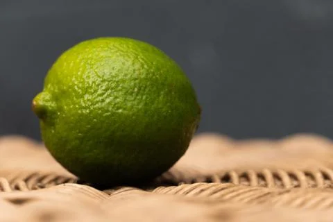 Green Lime with a Blue Background Stock Photos