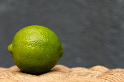 Green Lime with a Blue Background Stock Photos