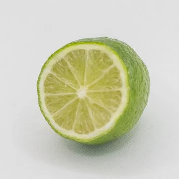 Green lime fruit on a white background Stock Photos