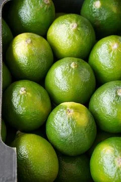 Green lime. Selective focus. Fresh limes as a food background or texture. Stock Photos
