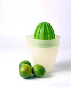 Green lime squeezer isolated on white background Stock Photos