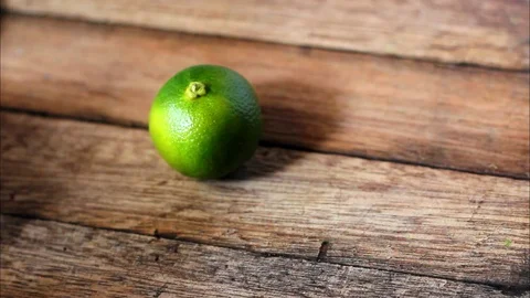 Green lime on wooden table. Stock-Footage 104689252