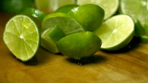Green Limes drop and bounce in Super Slow Motion Stock Footage