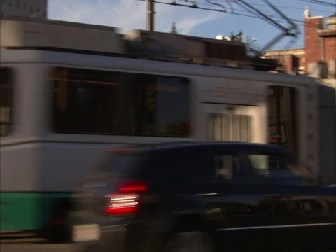 Green line train passes in front of old Peter Bent Brigham hospital. Stock Footage 86750302
