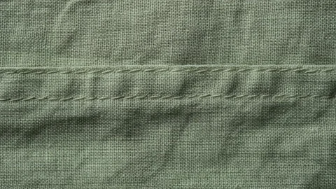 Green linen texture close up, sliding shot Video stock 195292992