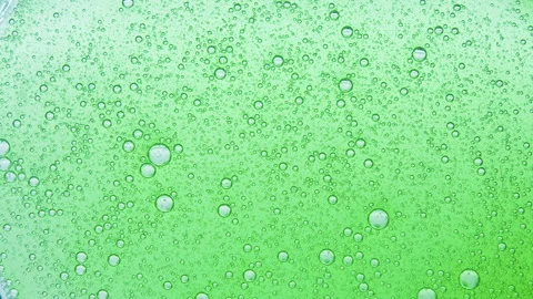 Green liquid with air bubbles. Stock Footage 242753523