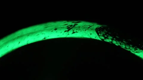 Green liquid arch, green light on a dark background Stock Footage 291468399
