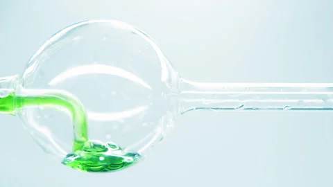 Green liquid  in glass flask. Stock Footage 242803666