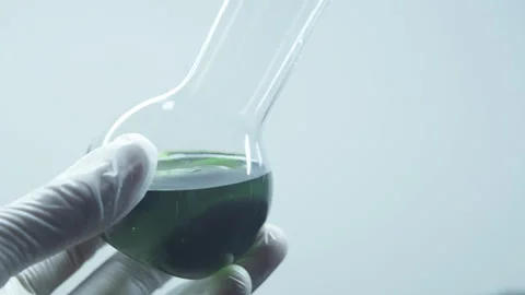 Green liquid in a laboratory flask. Stock Footage 242804743